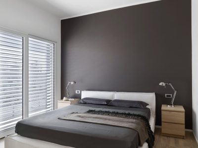interiors shots of a modern bedroom in the foreground the fabric bed the floor is made of parquet floor