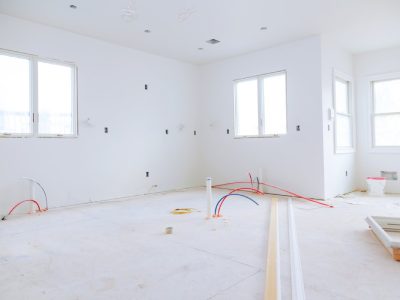 Interior construction of housing project with drywall installed and patched without building is a new house for the installation